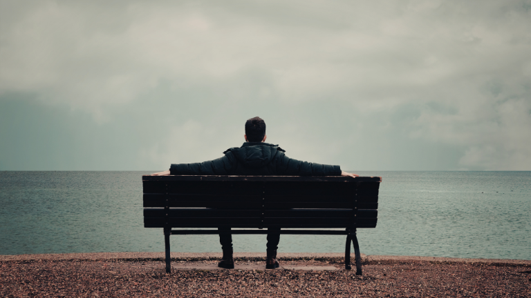 person sitting quietly reflecting on purpose-driven life